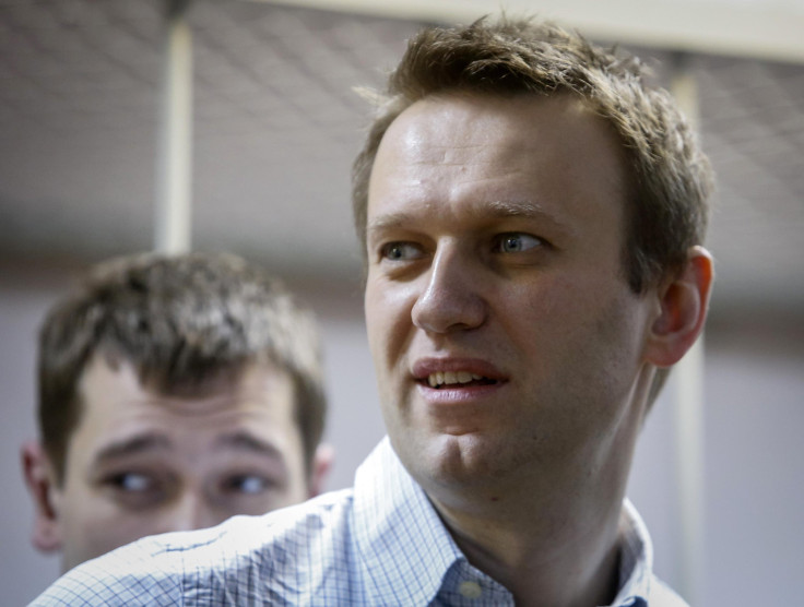 Watch a live stream of protests in support of recently sentenced Putin critic Alexey Navalny in Moscow. Navalny (front) and his brother and co-defendant Oleg attend a court hearing in Moscow, Dec. 30, 2014.