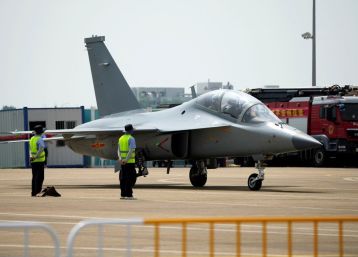 Pilots operate a JL-10 advance trainer jet of Chinese People's Liberation Army (PLA) Air ForceÂ at the China International Aviation and Aerospace Exhibition, or Airshow China, in Zhuhai, Guangdong province, China September 28, 2021.