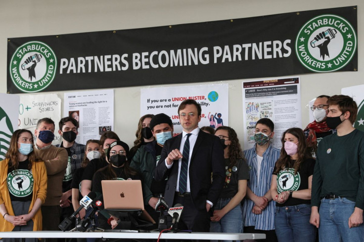 Attorney Ian Hayes and Starbucks workers speak during a news conference to react to a decision by the National Labor Relations Board to postpone a scheduled union vote count in Buffalo, New York, U.S., February 23, 2022.