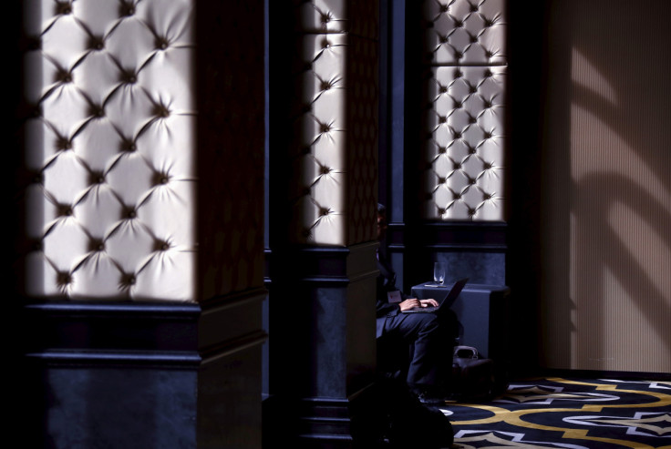 A delegate at the FireEye Cyber Security Summit uses his laptop during a break in sessions at a venue in Sydney, Australia