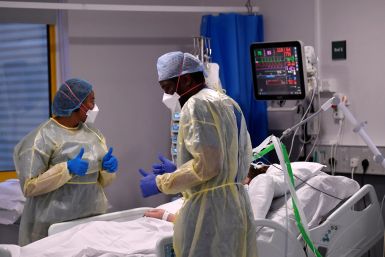 Neurosurgeons examining a patient