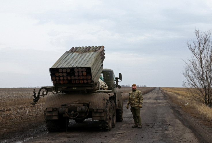 A Ukrainian serviceman of a fire platoon waits for order to fire a rocket from an MLRS, near the frontline, in Donetsk region