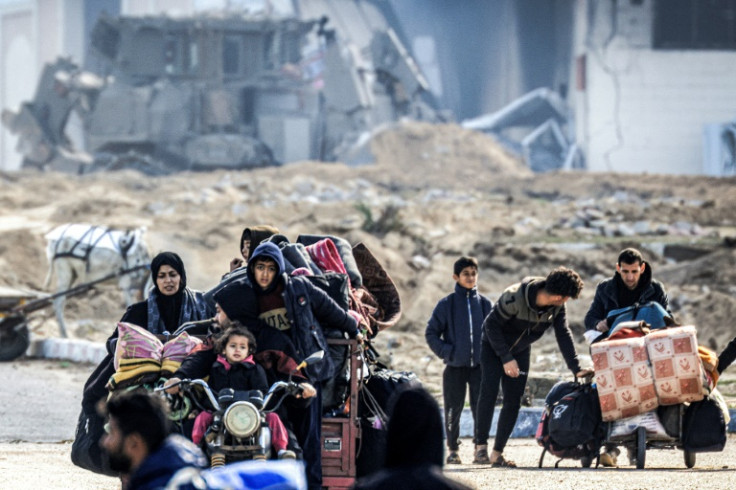 Displaced Palestinians flee from Khan Yunis in the southern Gaza Strip on January 30, 2024, amid the ongoing conflict between Israel and Hamas