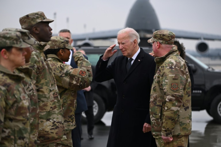 President Joe Biden greets military personnel ahead of the 'dignified transfer' ceremony for three slain US soldiers