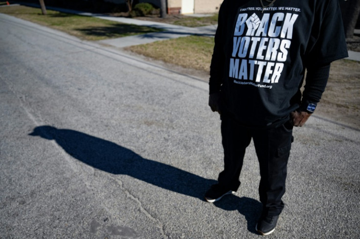 Warren Simmons wears a “Black Voters Matter” T-shirt as he ushers voters at the Royal Missionary Baptist Church polling location in North Charleston, South Carolina, on February 3, 2024, during the democratic primary. South Carolina is the first official