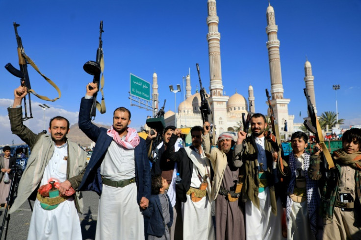 Armed Yemeni demonstrators take to the streets of the Huthi-controlled capital Sanaa, to show their support to Palestinians in the Gaza Strip on February 2, 2024