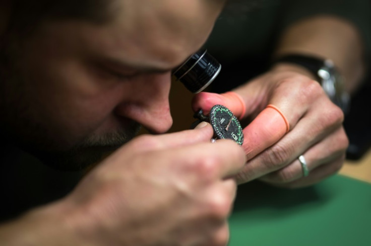 ID Geneve brand co-founder Cedric Mulhauser works on a watch movement