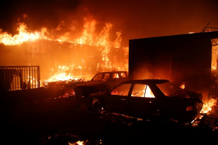 Vehicles and homes burn during a fire in Viña del Mar, Chile, on February 2, 2024