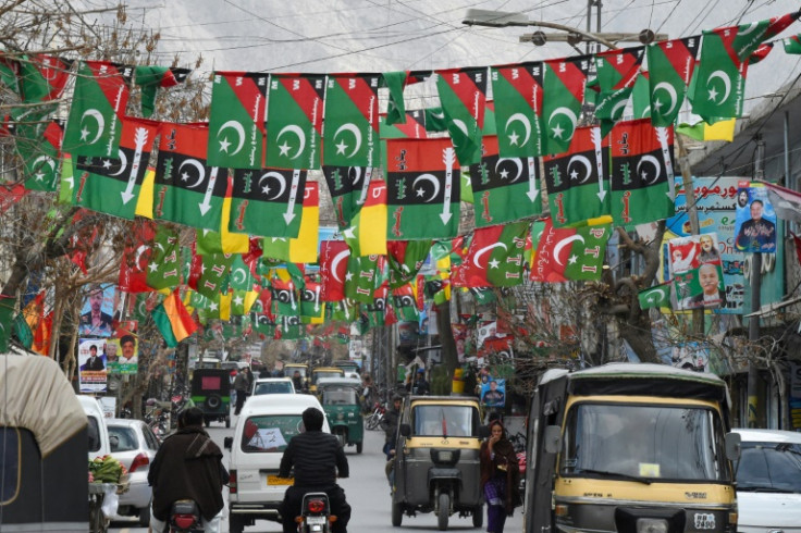 The flags of various parties hang over a street in Quetta, southwestern Pakistan