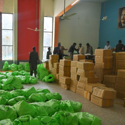 Workers prepare voting materials for distribution in Islamabad ahead of Thursday's election