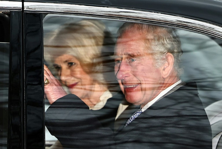 Britain's King Charles III and Queen Camilla wave, as the monarch made his first public appearance since being diagnosed with cancer