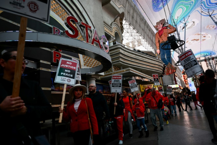Supporters of the Culinary Workers Union carry picket signs calling for a fair contract outside the Golden Nugget casino in Las Vegas on February 2, 2024