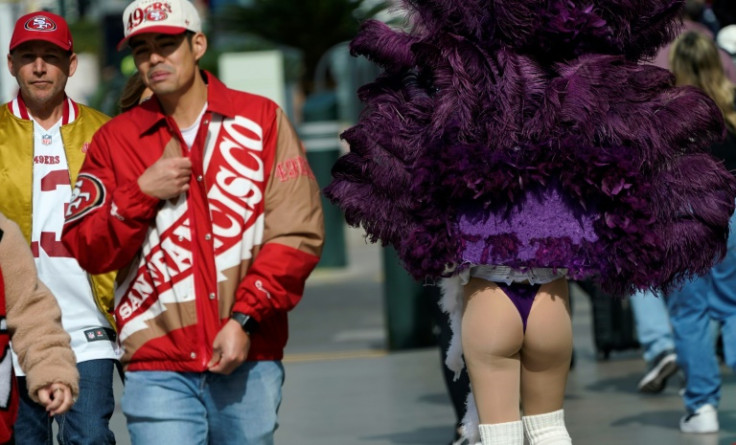 San Francisco 49ers fans on the Las Vegas strip, part of a horde which has descended on Las Vegas for Sunday's Super Bowl