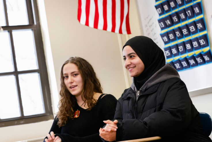 Rawda Elbatrawish (R) and Liora Pelavin speak during an interview at Teaneck High School in Teaneck, New Jersey, a city with large Jewish and Muslim populations that was shaken by the attacks of October 7