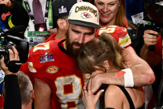 US singer-songwriter Taylor Swift and Kansas City Chiefs' tight end Travis Kelce embrace after the Super Bowl on Sunday