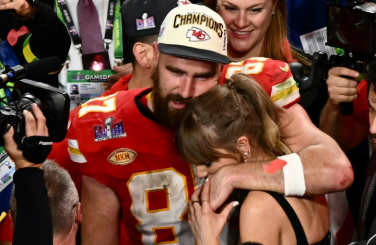 US singer-songwriter Taylor Swift and Kansas City Chiefs' tight end Travis Kelce embrace after the Super Bowl on Sunday