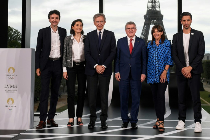 LVMH announced its sponsorship last July at a ceremony attended by Antoine Arnault (far left) and his father Bernard (third from left)