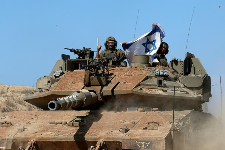 An Israeli tank is seen along the border with Gaza