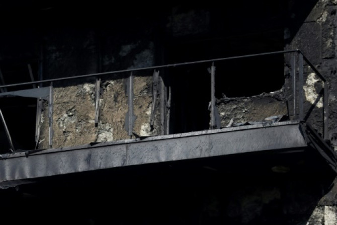 The blaze blew out the windows of the tower block and charred the once-white facade