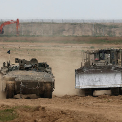 Israeli army vehicles along the border with the Gaza Strip, where plans to establish a security buffer zone are already underway