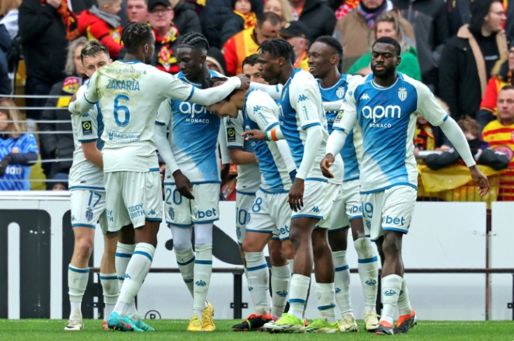 Monaco's Japanese forward Takumi Minamino (centre) celebrates his last gasp goal