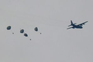 A Jordanian military aircraft drops humanitarian aid over Rafah