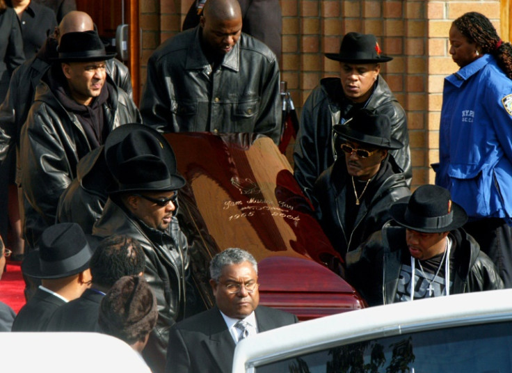 The coffin of Run-DMC's Jam Master Jay, the rapper born Jason Mizell, is carried out of a cathedral in Queens, New York, after his funeral in November 2002
