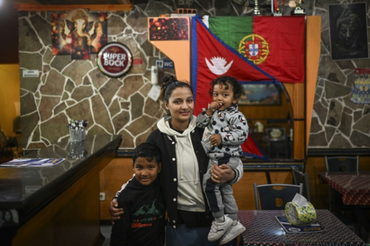 Nepalese cafe owner Ritu Khatri with her children in Sao Teotonio, Portugal