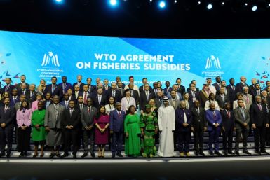 Delegates take a group picture during a session on fisheries subsidies during the 13th WTO Ministerial Conference in Abu Dhabi of February 26, 2024. The world's trade ministers gathered in the UAE on February 26 for a high-level WTO meeting with no clear 