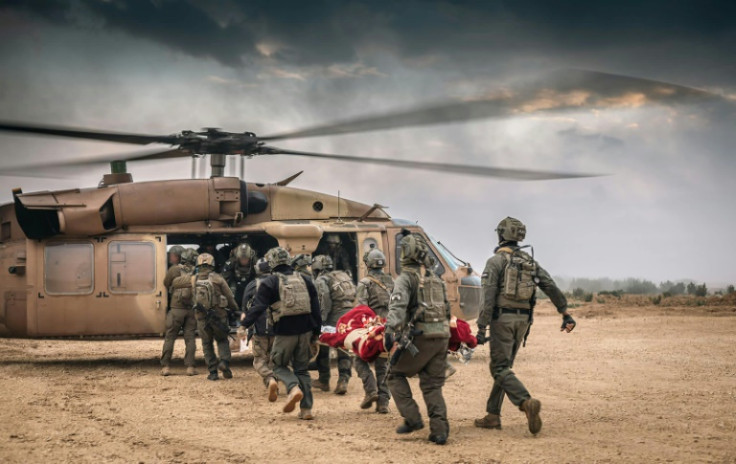 Israeli troops evacuate a wounded soldier during operations in the Gaza Strip