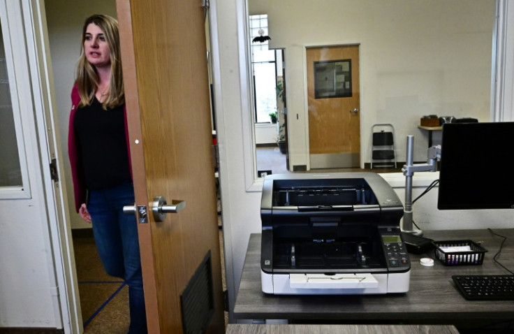Election Registrar Joanna Francescut shows the new machines designed to count votes in Shasta County, California, on February 23, 2024