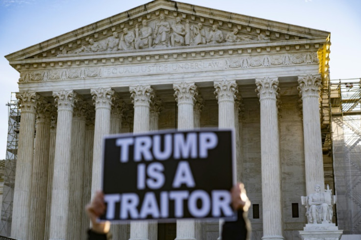 Anti-Trump demonstrators protest outside the US Supreme Court as the court considers whether former US President Donald Trump is eligible to run for president in the 2024 election in Washington, DC, on February 8, 2024