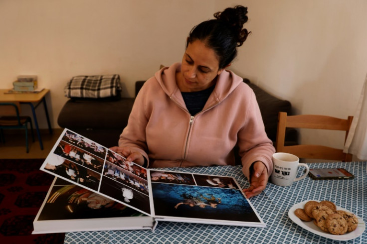 Bibas's sister-in-law, Ofri Bibas Levi, looks at a family photo album