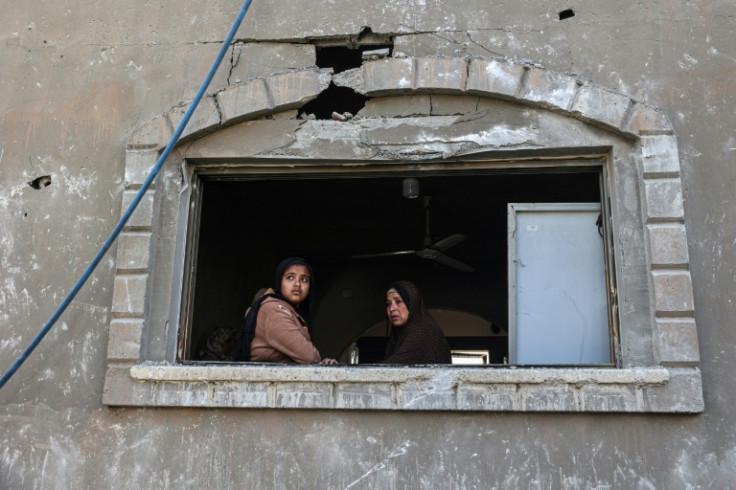 Palestinians at a home in Khan Yunis in southern Gaza after an Israeli air strike overnight