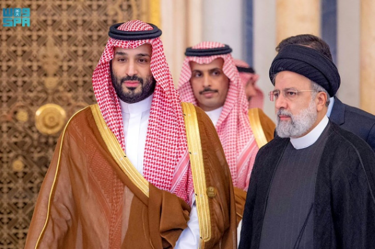 Saudi Crown Prince Mohammed bin Salman (L) walks with Iranian President Ebrahim Raisi at a November meeting of the Organisation of Islamic Cooperation on the war in Gaza