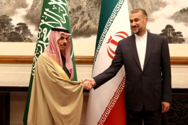 Saudi Foreign Minister Prince Faisal bin Farhan (L) shakes hands with Iranian counterpart Hossein Amir-Abdollahian in Beijing in April to seal the previous month's surprise reconciliation deal
