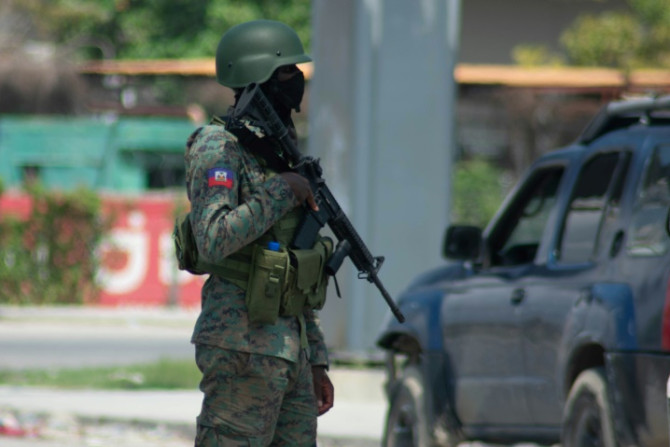 As the evening drew in, heavily armed security forces wearing ballistic helmets stood guard in Port-au-Prince, which was quieter than usual on Wednesday