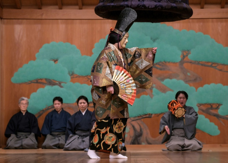 Mayuko Kashiwazaki (C) performs during a dress rehearsal for 'Dojoji', a famous Japanese traditional Noh drama