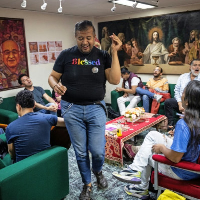 Wearing a T-shirt emblazoned with the word "blessed" in rainbow colors, LGBTQ activist Eduardo Andrade leads a choir practice in Mexico City