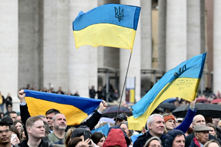 People waved Ukrainian flags on St Peter's square during Pope Francis's Sunday Angelus prayer at the Vatican