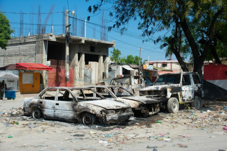 Charred vehicles remain parked as gang violence escalates in Port-au-Prince, Haiti, on March 9, 2024