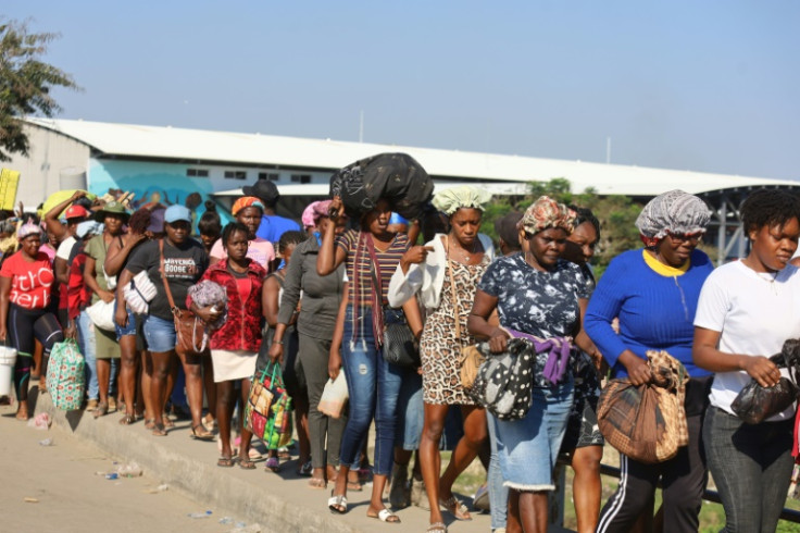 Haitians cross the border between Quanamienthe in Haiti and Dajabon in the Dominican Republic