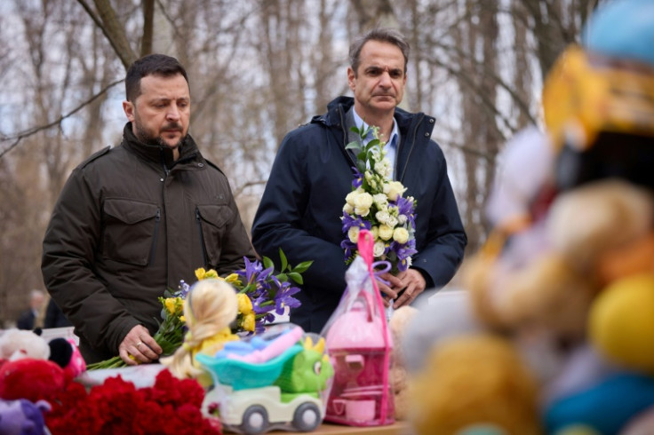 Ukrainian President Volodymyr Zelensky and Greece's Prime Minister Kyriakos Mitsotakis pay tribute to victims of a drone attack on Odesa