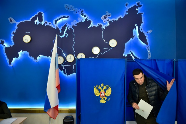 A man votes in Russia's presidential election in the Siberian city of Novosibirsk
