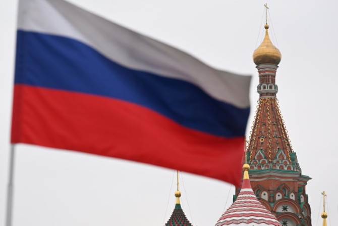 The Russian flag over Red Square after polls opened across the country in presidential elections