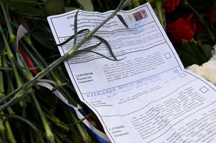 Alexei Navalny supporters left mock-up ballot papers at his grave