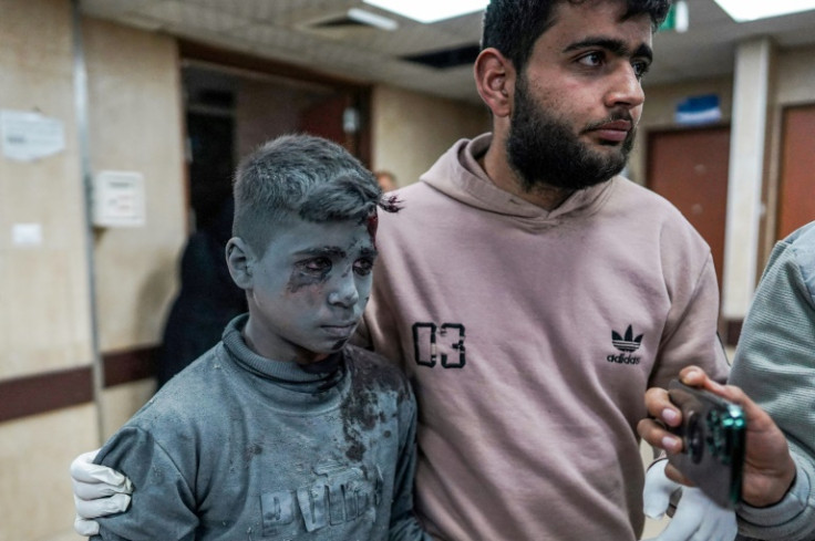 A wounded Palestinian child arrives at a hospital in Gaza, following an Israeli bombing