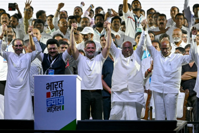India's Rahul Gandhi flanked by fellow opposition leaders at a campaign rally in Mumbai