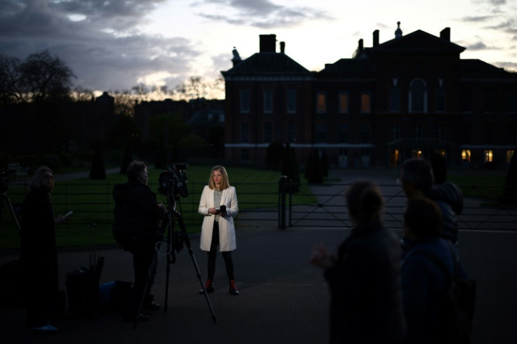 A journalist reports from outside Kensington Palace in London on March 22, 2024