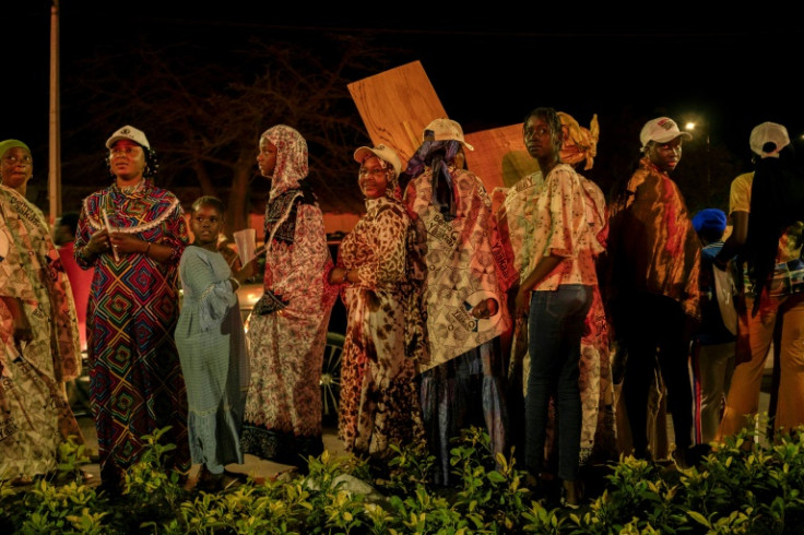 Supporters of governing coalition candidate Amadou Ba at a final campaign rally in Dakar